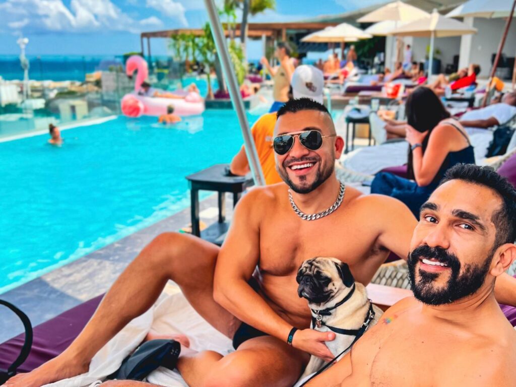 dog dad and his pug at roof top in Playa Del Carmen